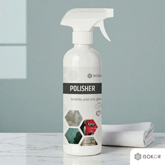 Sprayflaske med poleringsmiddel for keramikk, plast, lakk og glass på marmorbord, med klut.